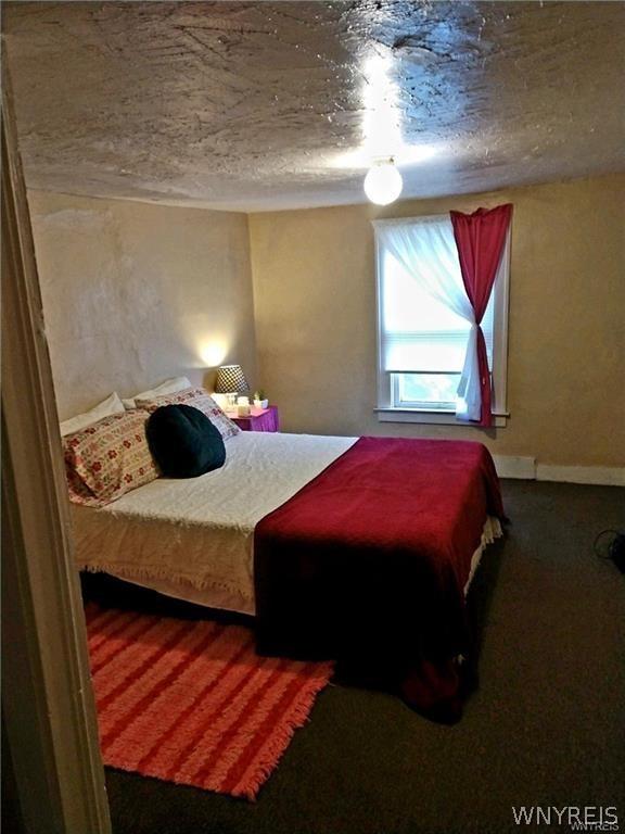 bedroom featuring a textured ceiling