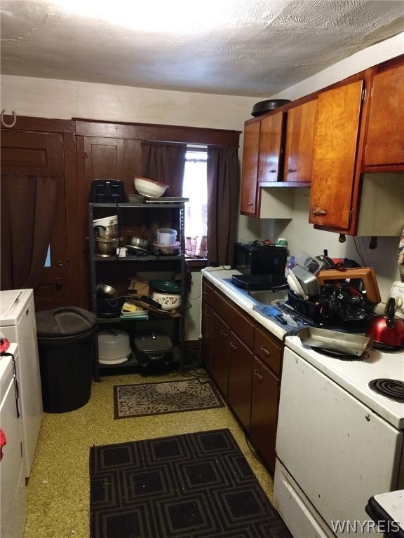 1510 Ashland Ave, Niagara Falls, NY 14301 - kitchen featuring white range oven, light flooring, light countertops, and black microwave