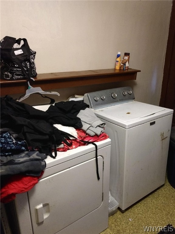 laundry area with washing machine and clothes dryer