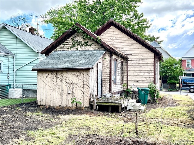 back of house featuring central AC