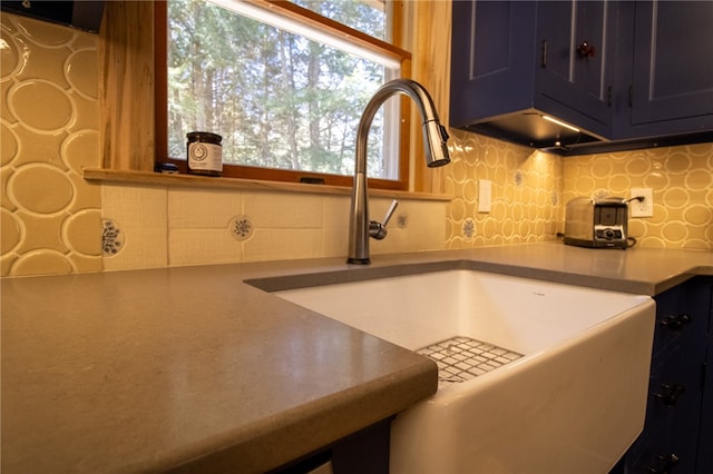 kitchen featuring sink and tasteful backsplash