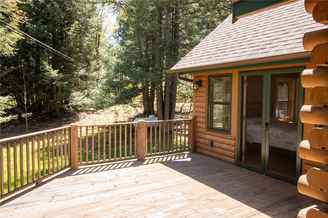 wooden deck featuring french doors