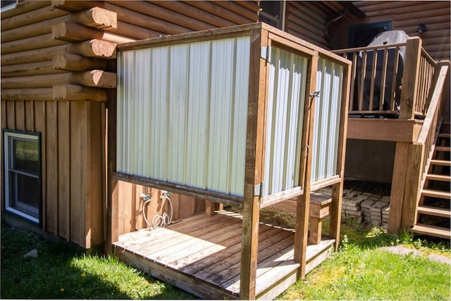 view of side of property featuring a deck