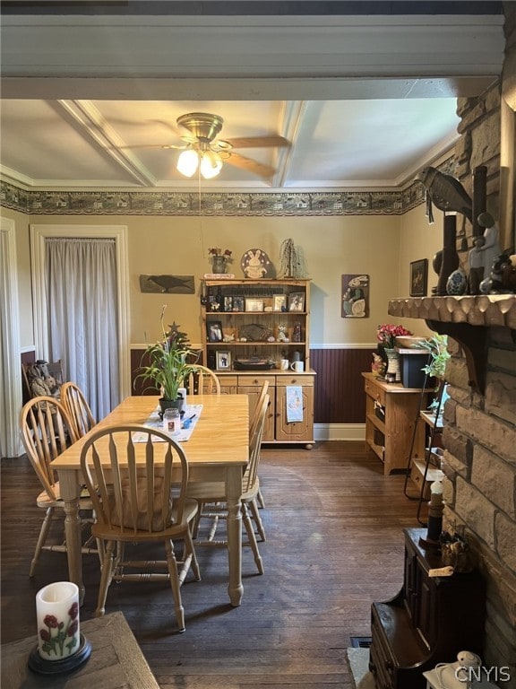 dining room with beamed ceiling, crown molding, dark hardwood / wood-style floors, and ceiling fan