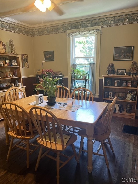 dining area with ceiling fan and dark hardwood / wood-style flooring