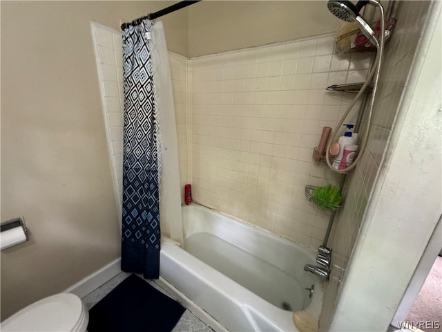 bathroom featuring toilet, tile floors, and shower / tub combo