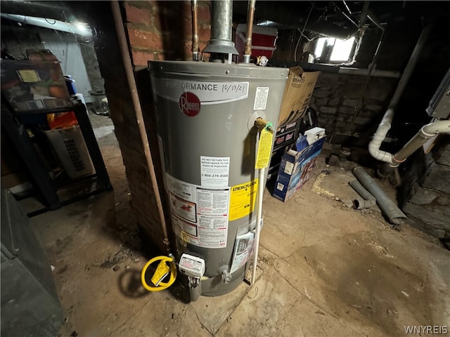 utility room featuring water heater