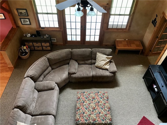 living room with carpet, ceiling fan, and french doors