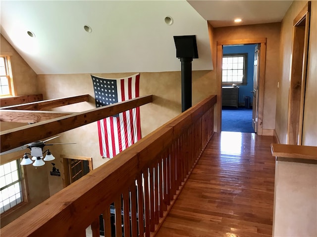 hallway with hardwood / wood-style flooring