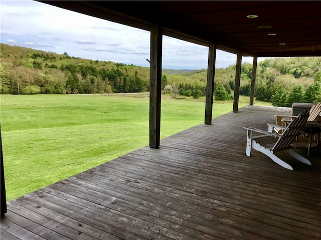 wooden deck with a yard