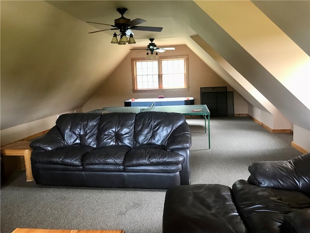 carpeted living room with ceiling fan and lofted ceiling