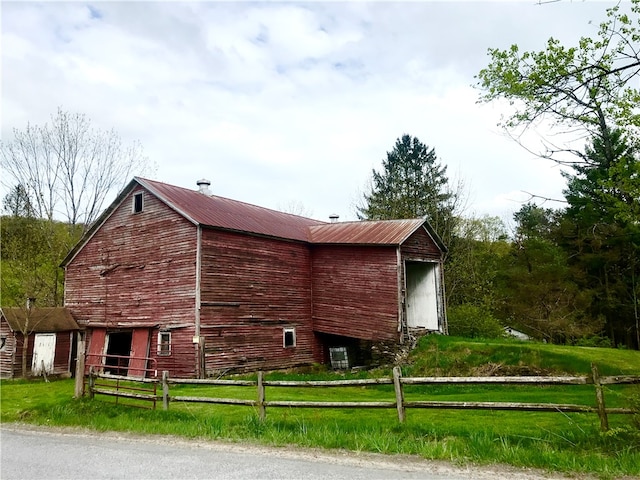 view of home's exterior with a yard