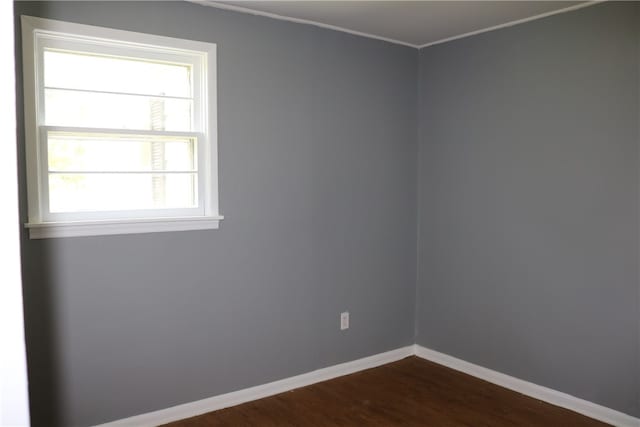 unfurnished room featuring hardwood / wood-style flooring