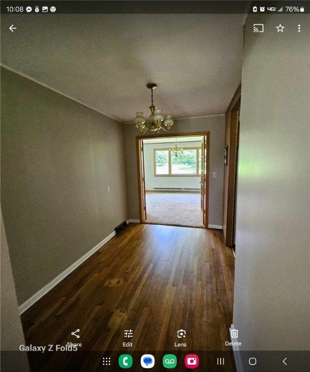 interior space featuring a notable chandelier and hardwood / wood-style flooring