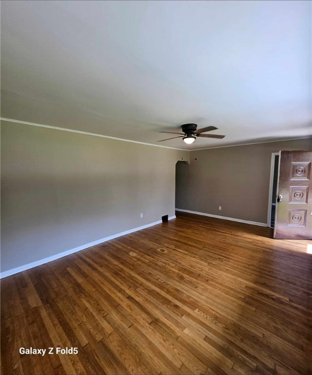 unfurnished room with ceiling fan and hardwood / wood-style flooring