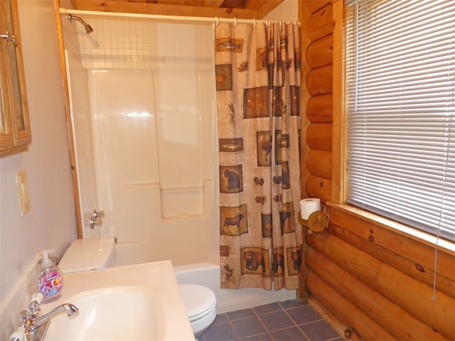 full bathroom featuring shower / bath combo with shower curtain, tile floors, sink, log walls, and toilet