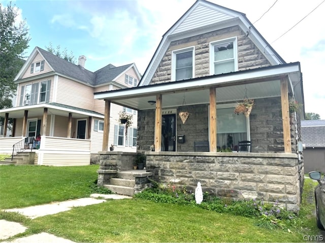 view of front of house with a front lawn and covered porch