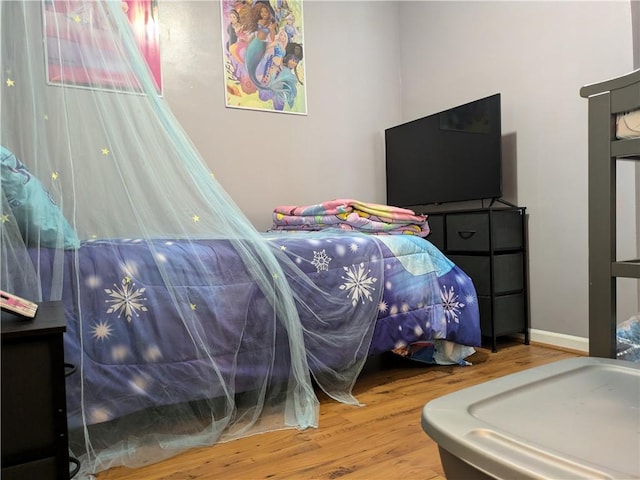 bedroom with wood-type flooring