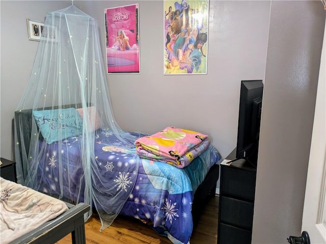 bedroom featuring wood-type flooring