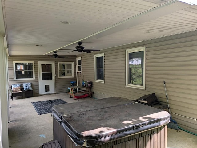 view of patio / terrace with a hot tub