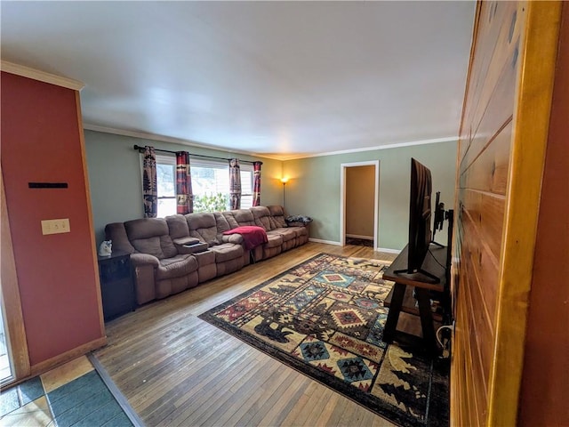 living room with wood-type flooring and ornamental molding