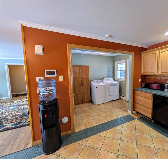 clothes washing area featuring separate washer and dryer, crown molding, light tile patterned floors, and a baseboard radiator