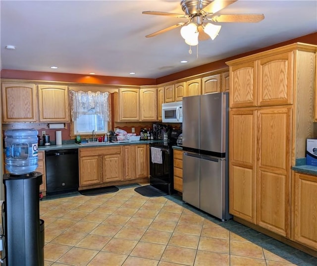 kitchen featuring light tile patterned floors, sink, ceiling fan, and black appliances