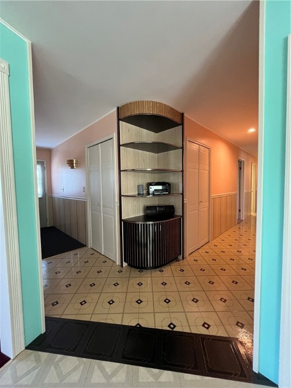 kitchen featuring wood walls