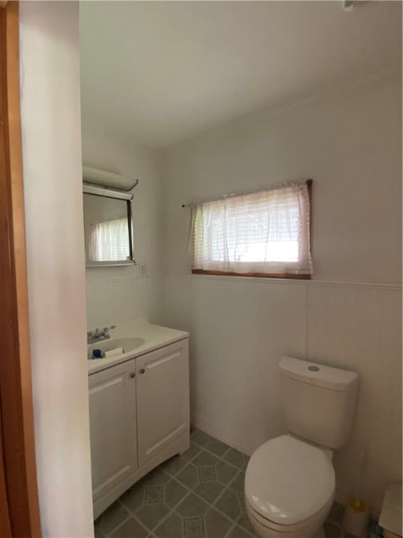 bathroom with vanity and toilet