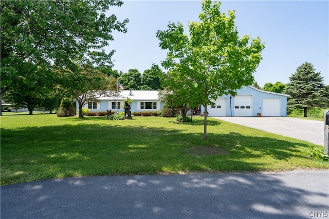 ranch-style home featuring a garage and a front lawn