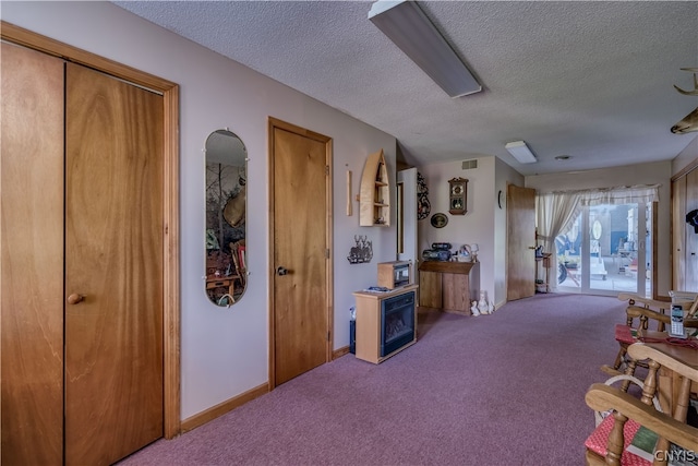 interior space featuring a textured ceiling