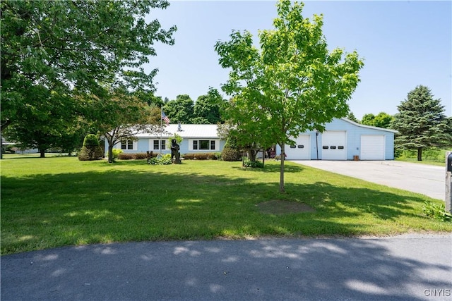 single story home featuring a garage and a front yard