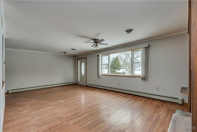 unfurnished room featuring crown molding, a baseboard radiator, and light hardwood / wood-style flooring