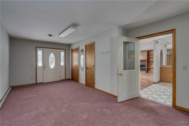 foyer with light carpet and a baseboard heating unit