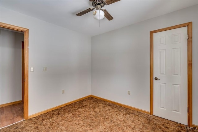 unfurnished bedroom featuring ceiling fan and carpet flooring