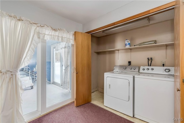 laundry area with carpet and washer and clothes dryer