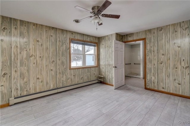 unfurnished bedroom with a baseboard radiator, ceiling fan, and light wood-type flooring