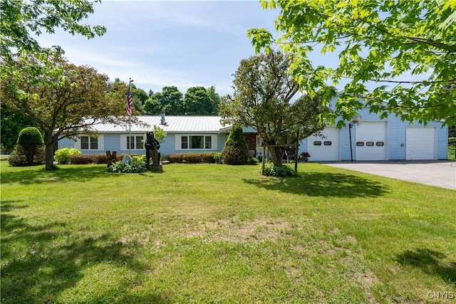 single story home with a garage and a front lawn