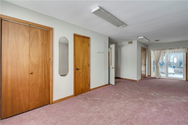 unfurnished bedroom featuring carpet flooring