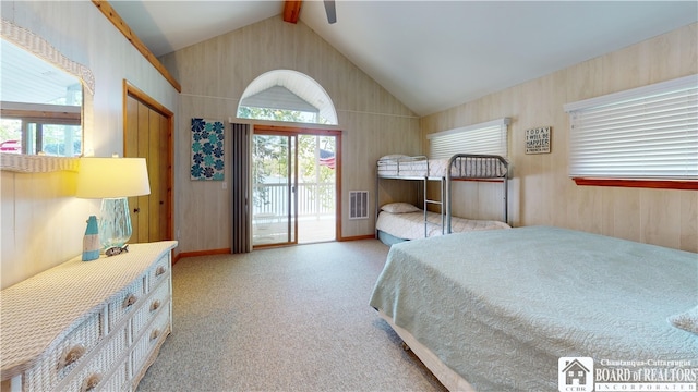 carpeted bedroom with lofted ceiling with beams, ceiling fan, access to exterior, and multiple windows