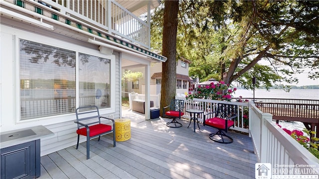 deck featuring a water view