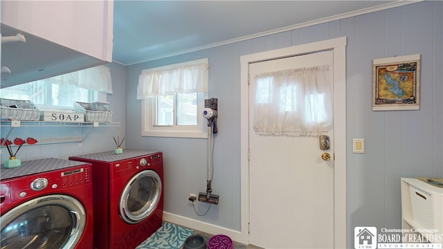 laundry area with washer and dryer and crown molding