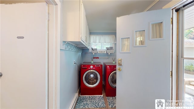 laundry area with tile floors and separate washer and dryer