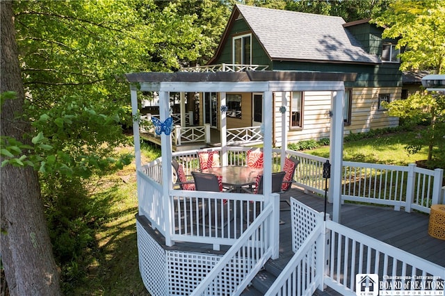 exterior space featuring a wooden deck and a yard