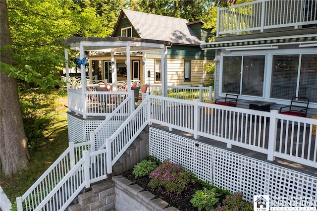 rear view of property featuring a pergola