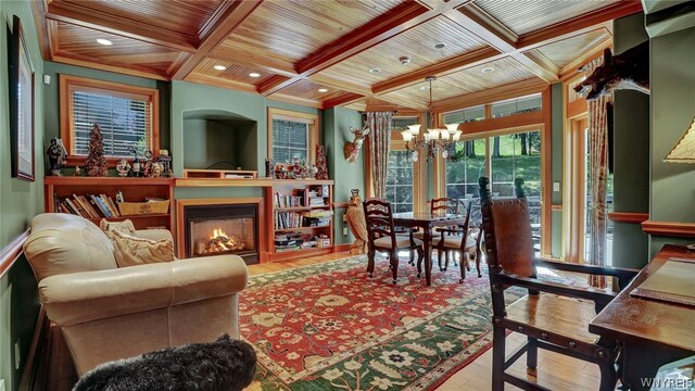 living room featuring light wood-type flooring, wooden ceiling, and coffered ceiling