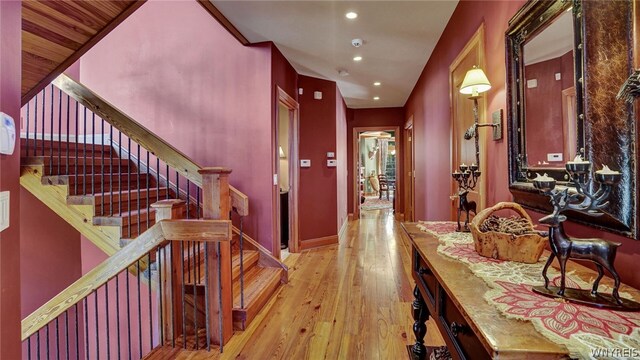 corridor with light hardwood / wood-style flooring