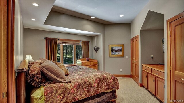 bedroom with light carpet