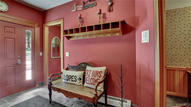 mudroom featuring a wealth of natural light and a baseboard heating unit