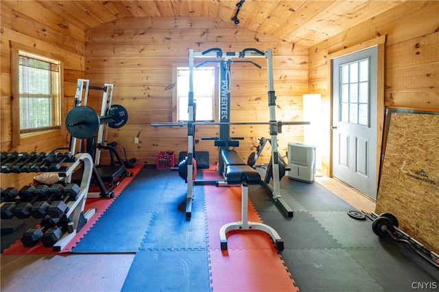 exercise room with vaulted ceiling and wood ceiling